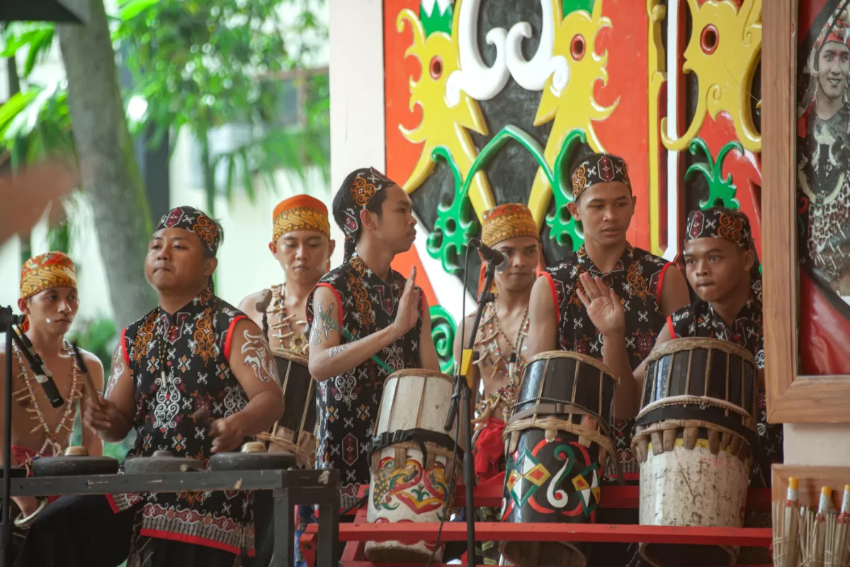 Jakarta, Indonesia, December 03, 2022 - Several men performing the Gandang Tatau is a musical instrument from the Kalimantan gandang type with a smaller size and a single head.  (Abah Baratawiria)