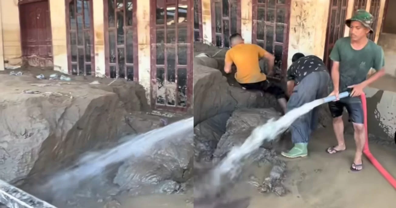 Tangkapan layar warga yang sedang membersihkan sisa lumpur yang menenggelamkan hampir separuh bangunan rumah. (TikTok/Mawa)