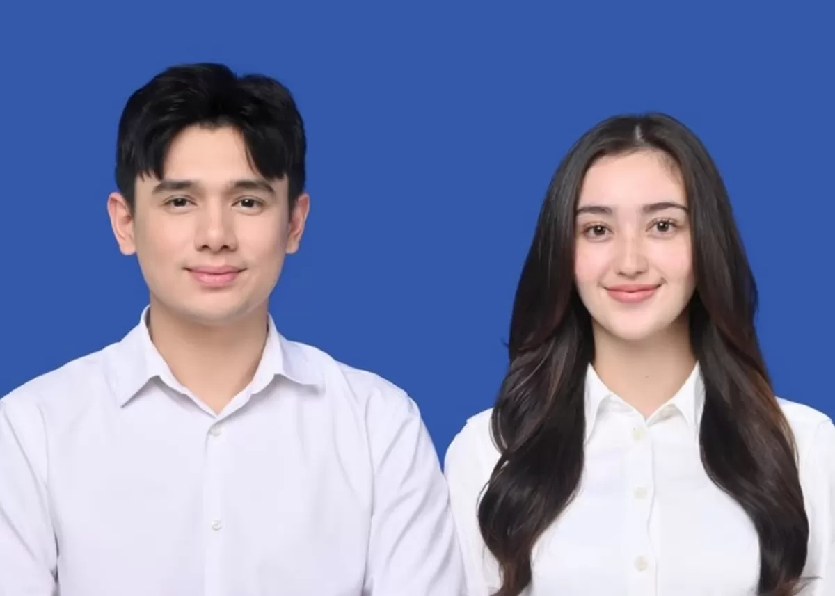 Potret Rayn Wijaya dan Ranty Maria dalam foto latar biru. (Instagram/@raynwijaya26)