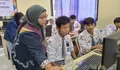 Dosen FTIK USM Berikan Pelatihan CapCut Siswa SMA Kesatrian 1 Kota Semarang