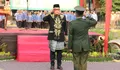 Upacara Penurunan Bendera Merah Putih Lancar, Aulia Rahman Serahkan Satyalancana Karya Satya dari Presiden 