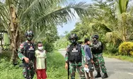 Tingkatkat Disiplin Prokes, Satgas Yonif 512 Bagikan Masker Kepada Masyarakat Perbatasan Papua.