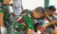 Satgas Yonif 512/QY Bantu Obati Masyarakat Yang Terluka