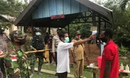 Satgas Yonif 512/QY Membantu Pemerintah Dalam Usaha Mencegah Penyebaran Virus Covid-19 di Wilayah Perbatasan NKRI