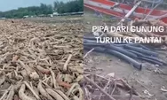 Warga Berebut Kayu  Yang Berserakan dan Pipa Air di Pantai Larangan yang Terbawa dari Wisata Guci
