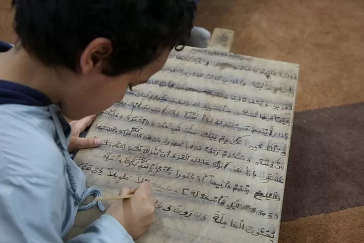 Ilustrasi Anak menulis (REUTERS/Hazem Ahmed)