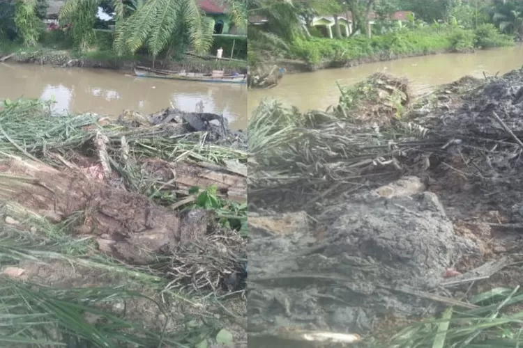 sampah sungai diduga ditimbun jadi benteng pinggir sungai.{foto/Realitasonline)