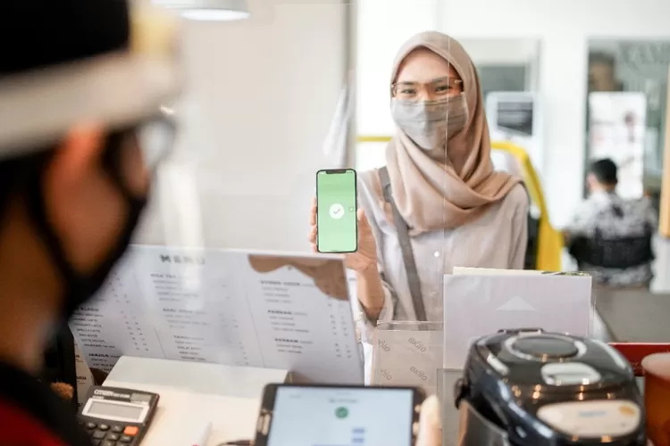 Ilustrasi pembayaran menggunakan GoPay. (Dok Gojek)